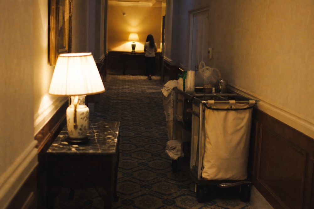 Guestroom hallway in a historic Savannah hotel with period furnishings, no text, no logos, no people