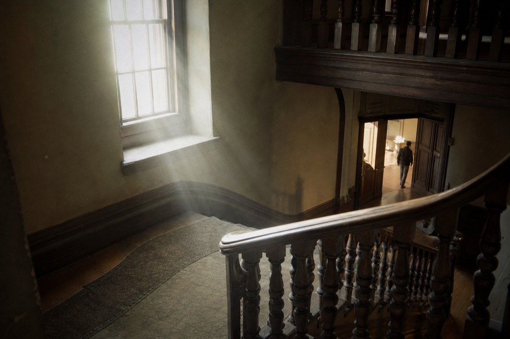 Antique wooden staircase inside a 19th century Savannah hotel, no text, no logos, no people