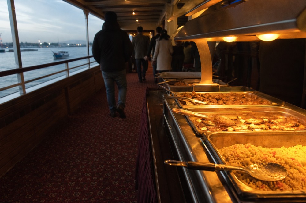 Buffet serving line aboard a riverboat dinner cruise, no text, no logos, no people
